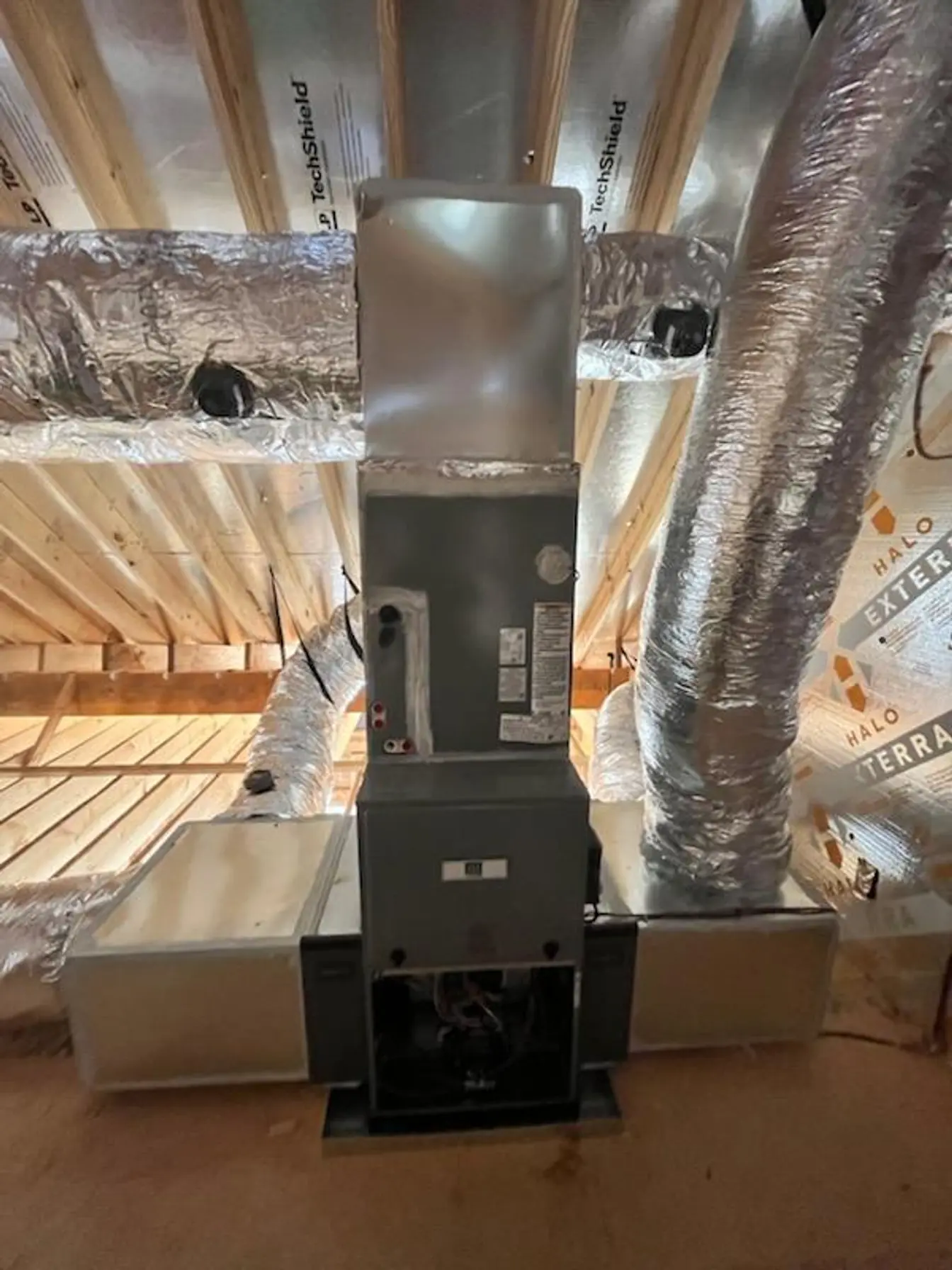 Furnace and air handler installed in an attic with new insulated flex duct